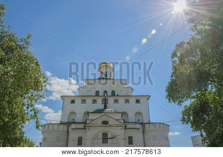 the architectural monument Golden gate in Vladimir city. the Golden ring of Russia. Bright the sun's rays illuminate the dome