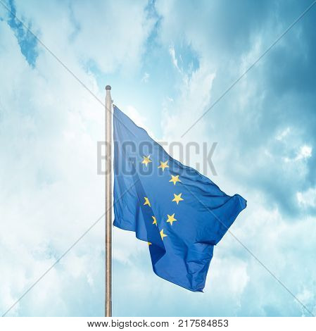 The flag of the European Union fluttering on the flagpole