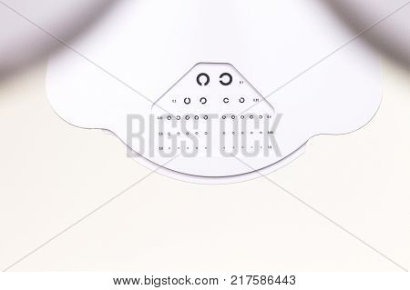 the cabinet of the eye doctor. eye sight test called landolt C. with copy space