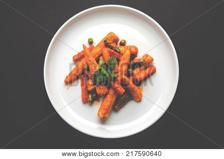 Indian Baby Corn Masala or spicy Baby corn curry served with roti or naan or indian bread