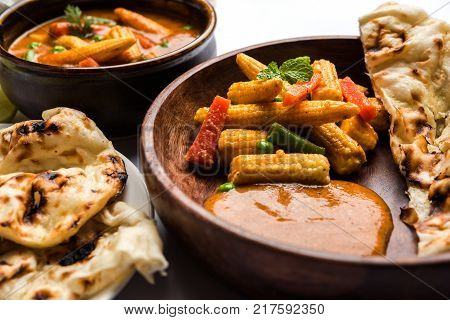 Indian Baby Corn Masala or spicy Baby corn curry served with roti or naan or indian bread