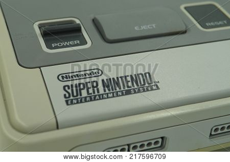 Almere, The Netherlands-  December 9, 2017: Selective focus close up of a Super Nintendo (SNES) Classic video game console.