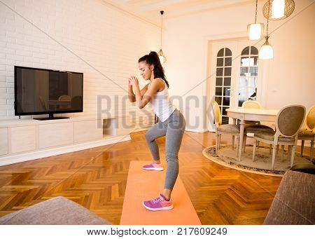 Fit Young Woman Exsercise In The Room
