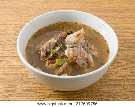 Thai Cuisine and Food Delicious Thai Clear Spicy Hot and Sour Soup with Beef Entrails in A Bowl.