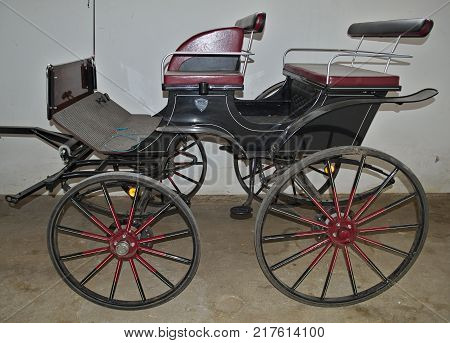 Vintage old style chariot in barn, close up