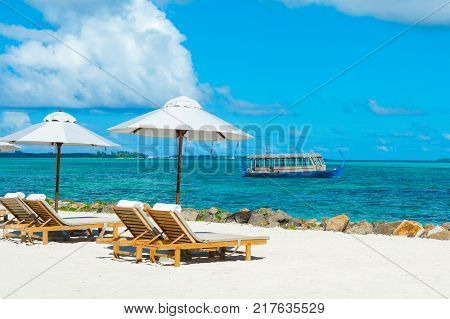 Wooden Maldivian traditional dhoni boat at sunny day on the turquoise Indian ocean water Maldives
