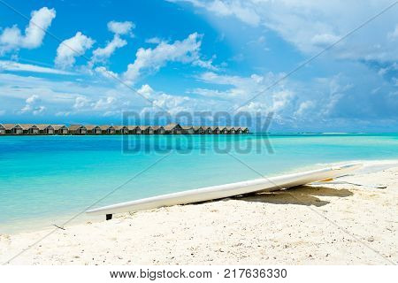 Stand up paddle board - SUP boards on a sandy beach Maldives