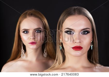 Two beautiful models with professional make up studio shot