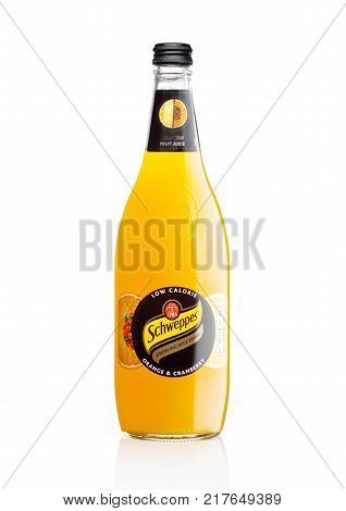 LONDON UK -DECEMBER 07 2017: Bottle of Schweppes orange juice sparkling drink on white background.