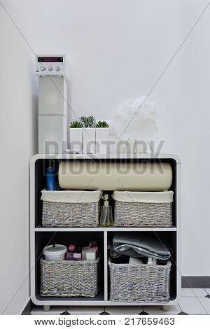 Interior of modern cosmetology office with curbstone for massage equipment