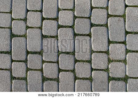Abstract background of old cobblestone pavement view from above