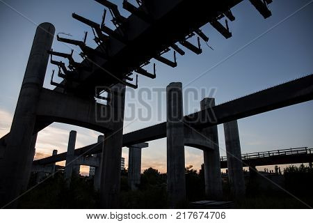 Unfinished bridge building clear sky architecture silhoette