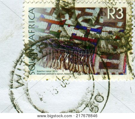 GOMEL, BELARUS, 5 DECEMBER 2017, Stamp printed in South Africa shows image of the Married woman's apron,Ndebele, circa 2010. 