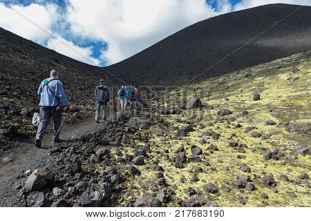 Kamchatka Peninsula, Russia - August 20, 2016: Tourists on excursions in places of Hiking trail climb to the North Breakthrough Great Tolbachik Fissure Eruption 1975