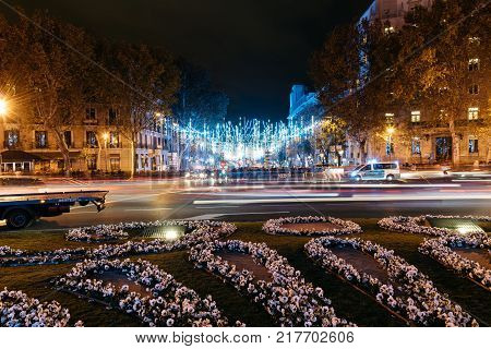 Madrid, Spain - December 8, 2017: Square of Independence in Madrid at night on Christmas Time. Long exposure shot with light trails of traffic
