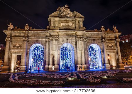 Madrid, Spain - December 8, 2017: Puerta of Alcala in Madrid at night on Christmas time.