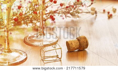 Decorative background, Champagne cork and glasses on a wooden table