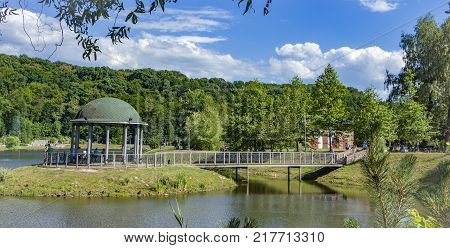 Gazebo in the park surrounded by fall foliage at autumn, Feofania