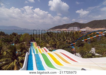 VINPEARL RESORT NHA TRANG VIETNAM - FEBRUARY 01 2015: The Multi Slide banana mat slides at Vinpearl Water Park Hon Tre Island Nha Trang Vietnam.
