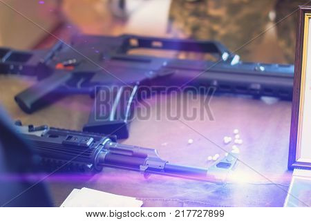 sub machine gun on the table master restorer in the interior gunsmith.