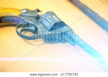 Old rusty revolver with the handgun bullets.