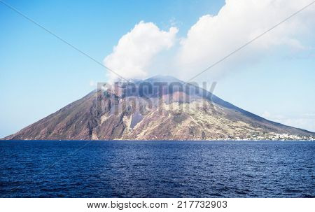Stromboli volcano seen from the boat. Stromboli is one of the eight Aeolian islands and one of three active volcanoes in Italy