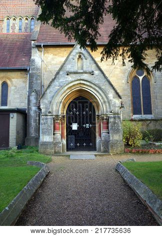 Bracknell, England - Dec 08, 2017: Path leading to porch entrance of St Michael's church which represents the Church of England in the town of Bracknell, United Kingdom