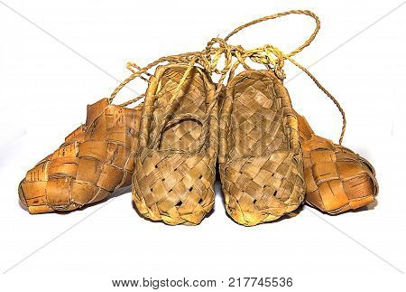 woven birch sandals for everyday wear in the village on a wooden background