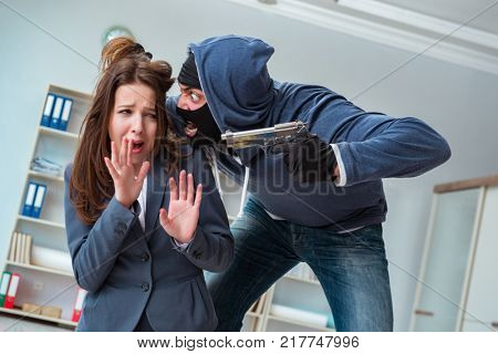 Criminal taking businesswoman as hostage in office