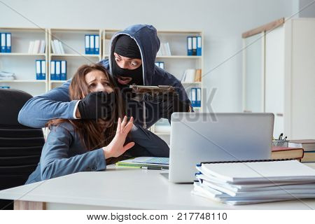 Criminal taking businesswoman as hostage in office