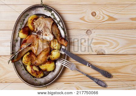 roast chicken with potatoes. copy space top view