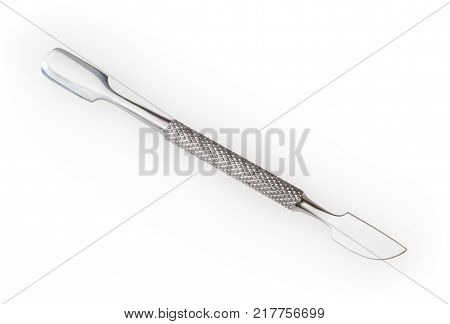 Steel manicure cuticle pusher isolated on white background with clipping path