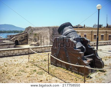 year 1684 old mortar medieval mortar in the Old Fortress of Corfu Town Greece.