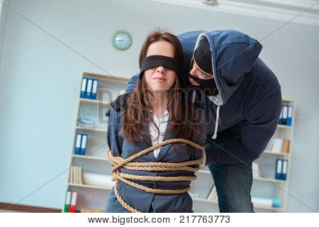 Criminal taking businesswoman as hostage in office