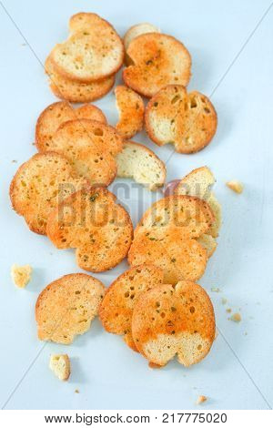Empty slices of crunchy garlic and herbs bruchette .
