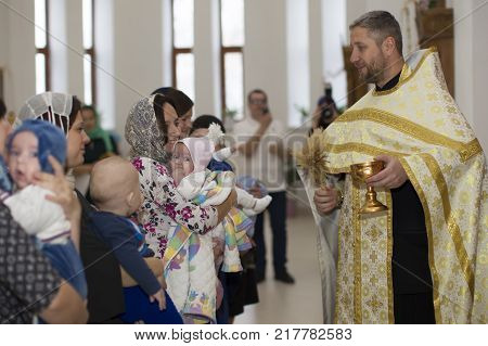 Belarus the city of Gomel on October 25 2017. Church of the farm. Baptism of the baby.Accept religion.The Rite of Baptism.The baby is in the church