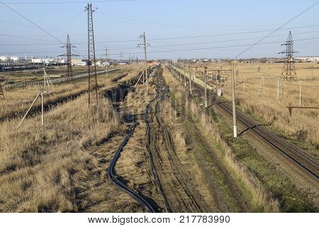 Plot railway. Top view on the rails. High-voltage power lines for electric trains.