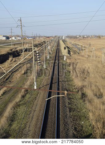 Plot railway. Top view on the rails. High-voltage power lines for electric trains.