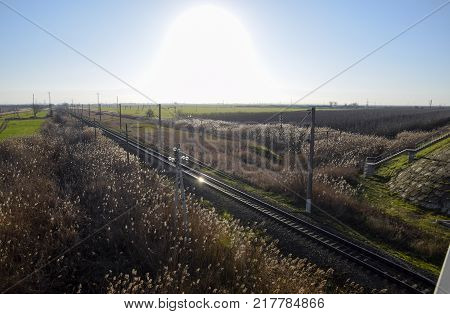 Plot railway. Top view on the rails. High-voltage power lines for electric trains.