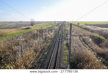 Plot railway. Top view on the rails. High-voltage power lines for electric trains.