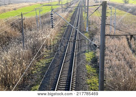 Plot railway. Top view on the rails. High-voltage power lines for electric trains.