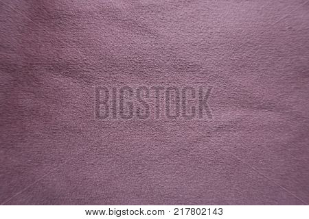Puce artificial suede fabric surface from above