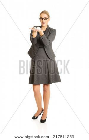 Businesswoman with plane toy in hand