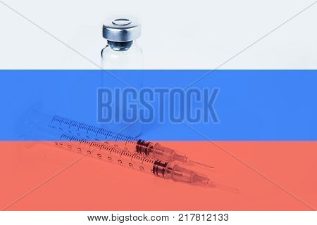 Medical syringe with doping against the background of the flag of Russia. Concept of doping in sport