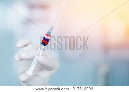 Medical syringe with doping against the background of the flag of Russia. Concept of doping in sport