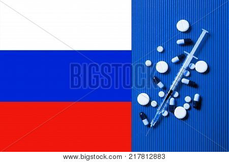 Medical syringe with doping against the background of the flag of Russia. Concept of doping in sport