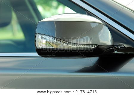 Car rear-view mirror with blinker, exterior detail