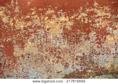 Closeup of red flaky old cracked texture background