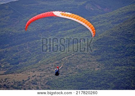 Paraglider flying wing in the French Alps