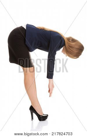 Beautiful caucasian business woman bending down.